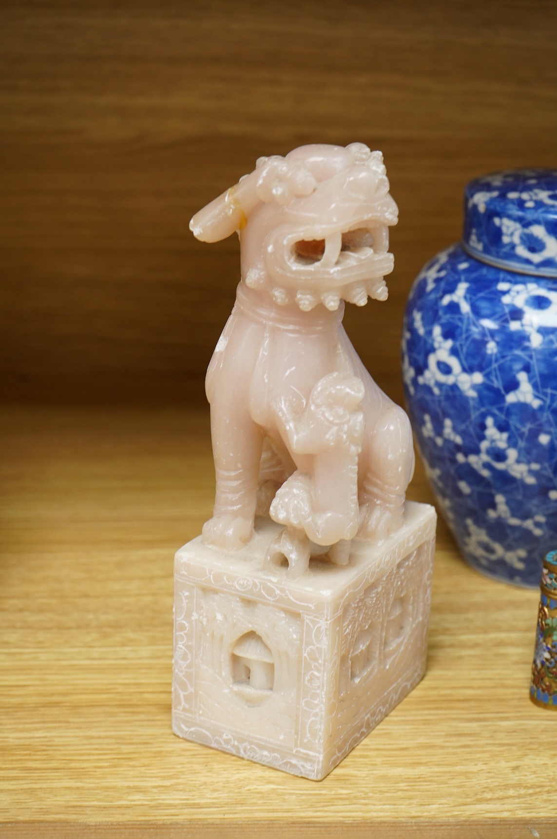 A pair of Chinese soapstone lion-dogs - 22.5cm high, two cloisonné enamel boxes and covers and a blue & white jar & cover